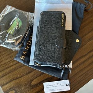 Brand new with tags. Black iPhone 11 Pro Folio case with credit card pocket.